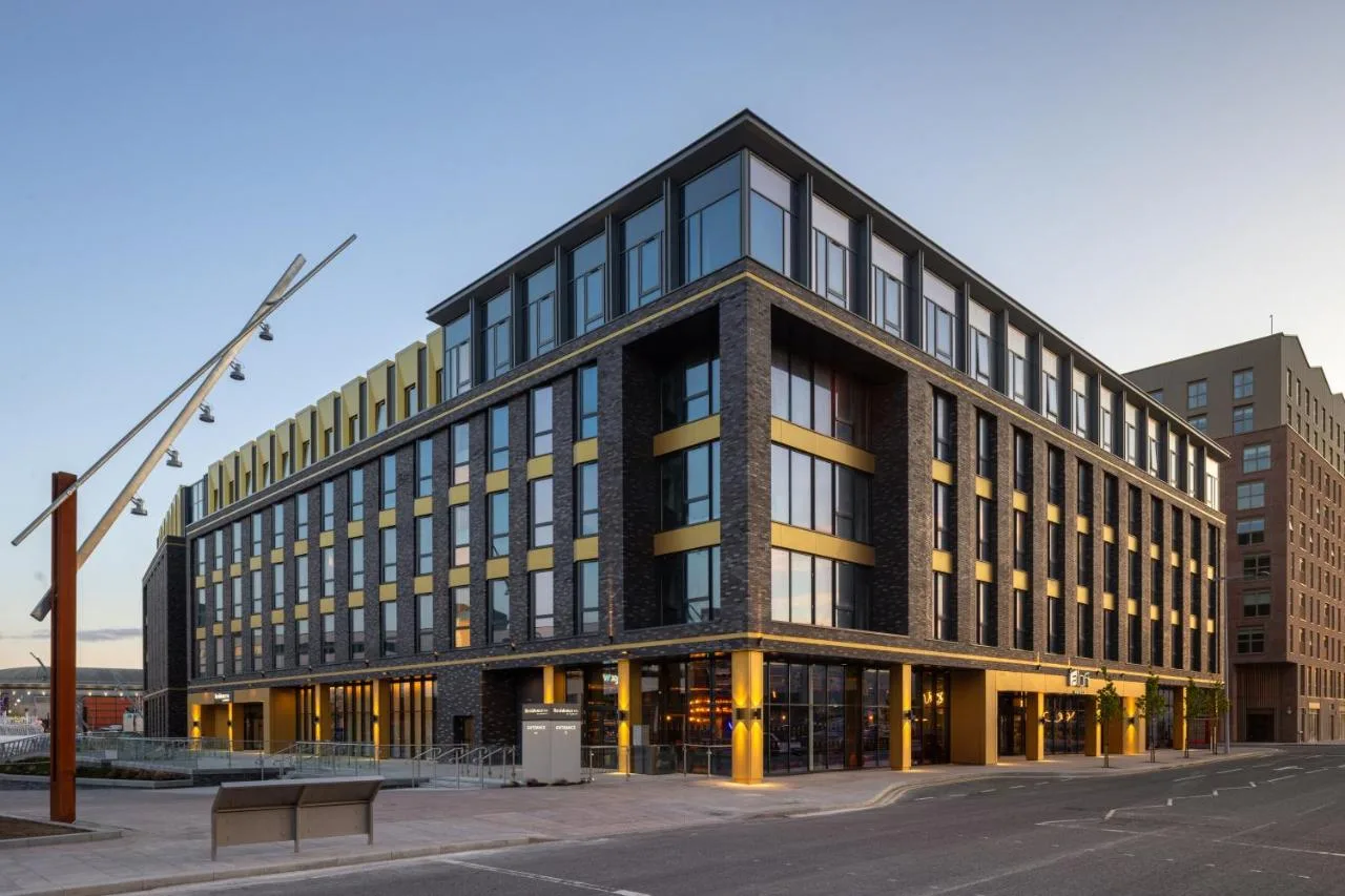 a large office building with a lot of windows at Residence Inn by Marriott Belfast Titanic Quarter in Belfast