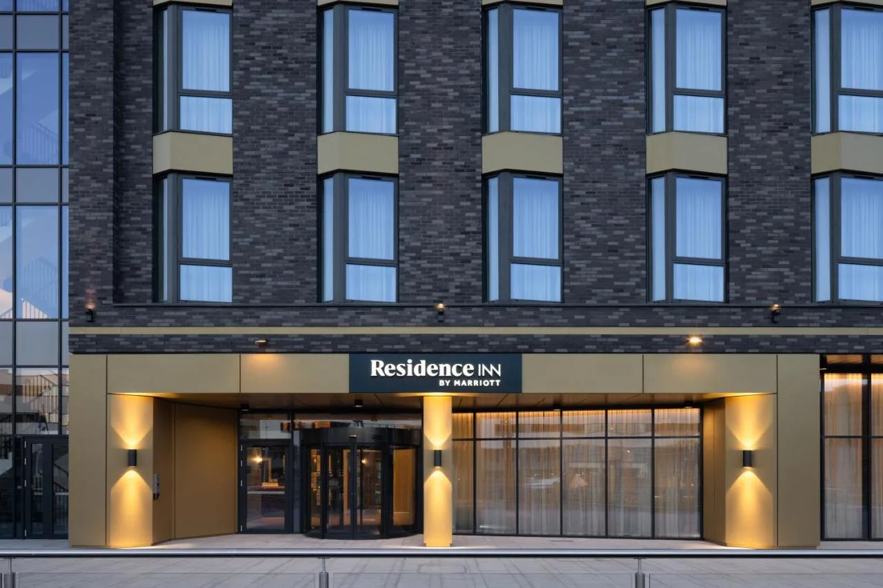 a facade of a brick building with a reference entrance at Residence Inn by Marriott Belfast Titanic Quarter in Belfast